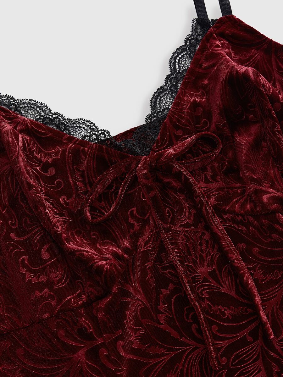 Plus size velvet slip dress featuring delicate contrast lace trim, spaghetti straps, and flared mini skirt with matching arm sleeves.