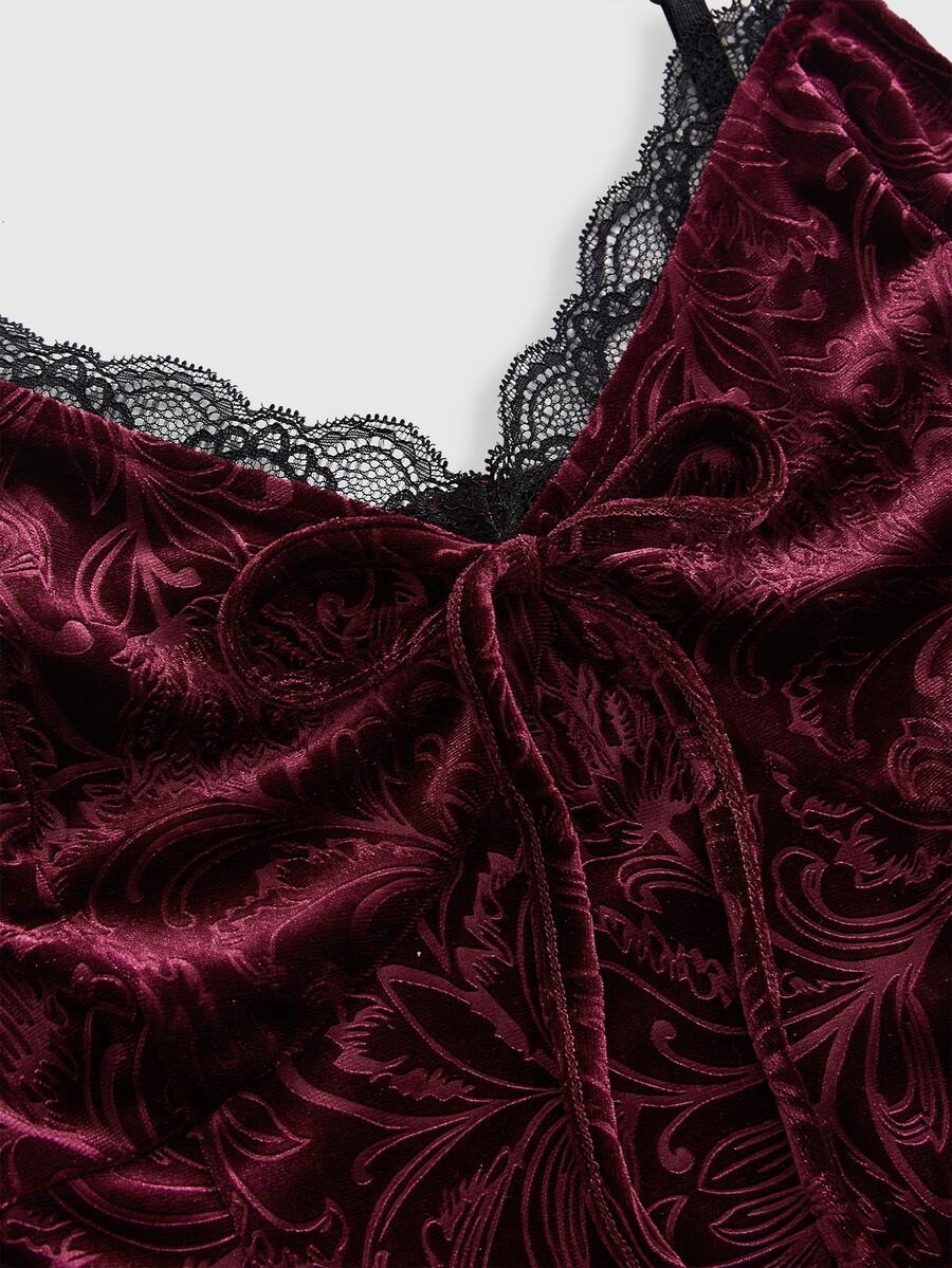 Plus size velvet slip dress featuring delicate contrast lace trim, spaghetti straps, and flared mini skirt with matching arm sleeves.
