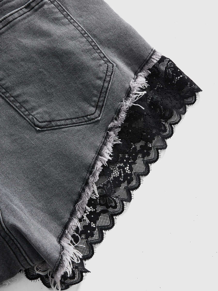 Front view of women's plus size skinny denim shorts featuring lace patchwork detailing, mid-rise waist, button zipper closure, and classic pockets.