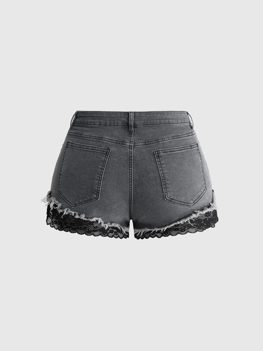 Front view of women's plus size skinny denim shorts featuring lace patchwork detailing, mid-rise waist, button zipper closure, and classic pockets.