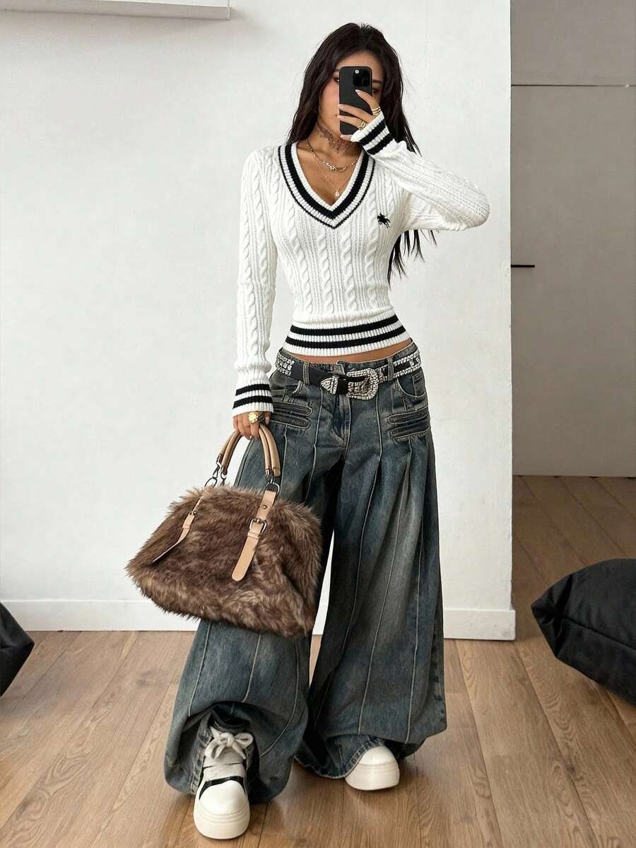 Women's slim fit cable-knit sweater with a V-neckline and long sleeves in solid green rib knit fabric.