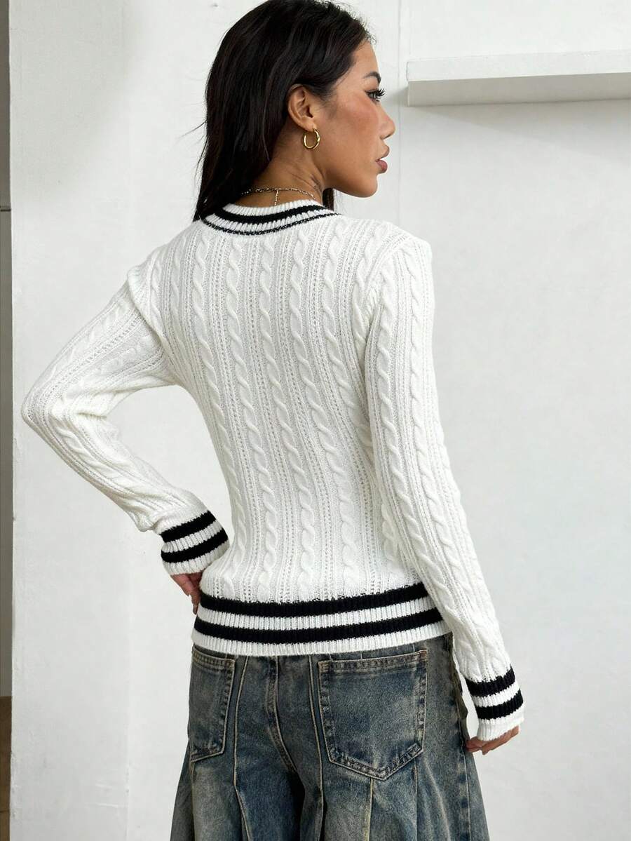 Women's slim fit cable-knit sweater with a V-neckline and long sleeves in solid green rib knit fabric.