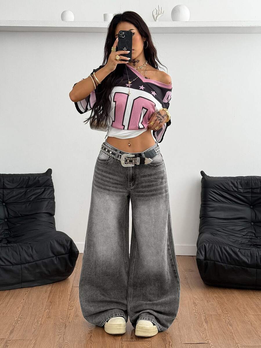 Loose wide leg denim jeans for women featuring a low waist, functional pockets, zipper fly closure, and extra long relaxed fit.