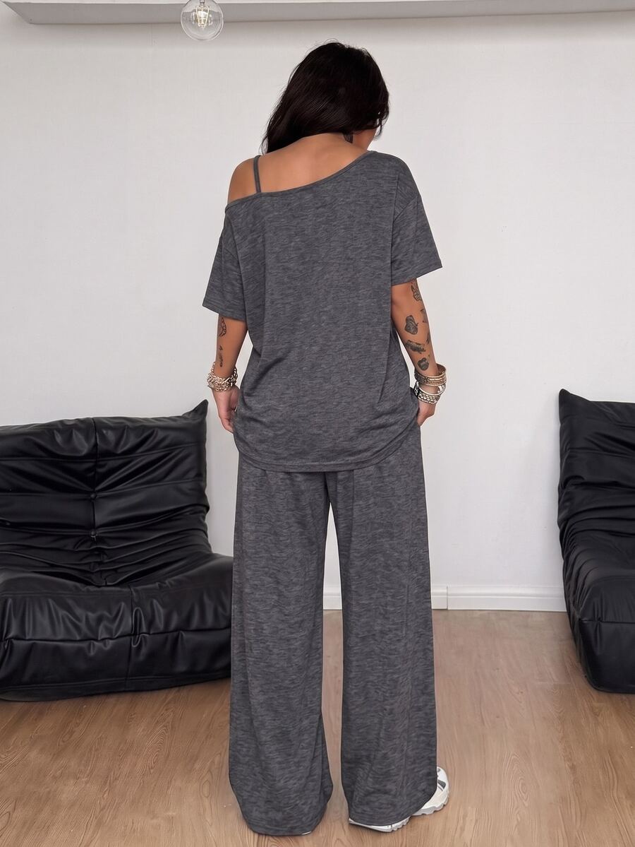 Women's two-piece outfit featuring an oversized asymmetrical neck t-shirt and matching wide-leg drawstring sweatpants.