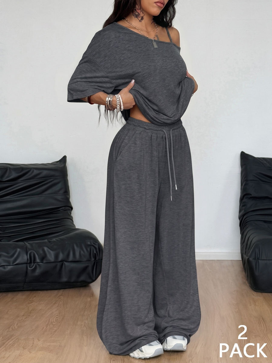 Women's two-piece outfit featuring an oversized asymmetrical neck t-shirt and matching wide-leg drawstring sweatpants.