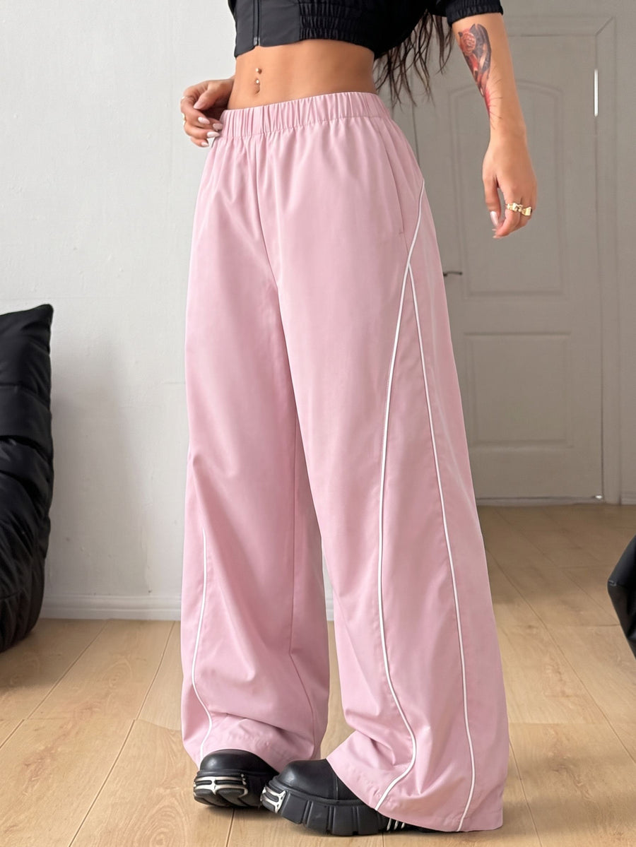 Plus size loose straight leg casual pants with elastic drawstring waist, contrast binding, and side pockets.