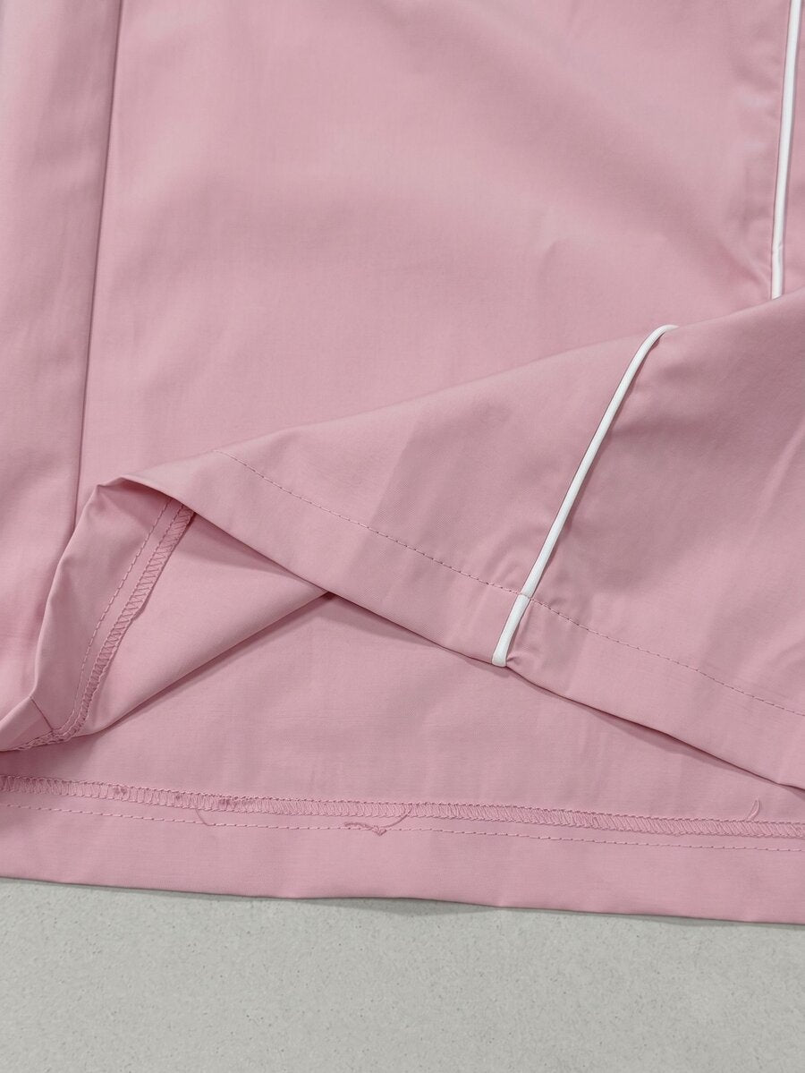 Plus size loose straight leg casual pants with elastic drawstring waist, contrast binding, and side pockets.