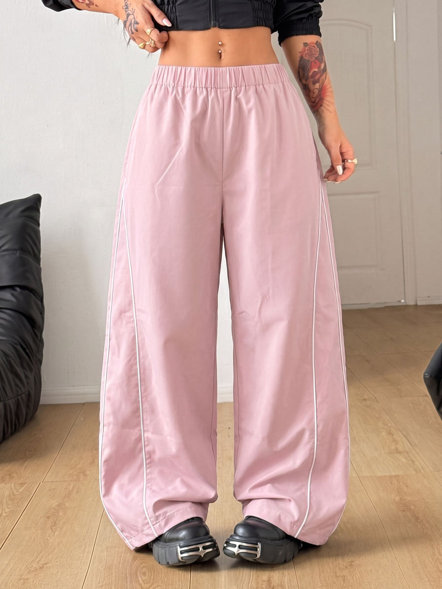 Plus size loose straight leg casual pants with elastic drawstring waist, contrast binding, and side pockets.