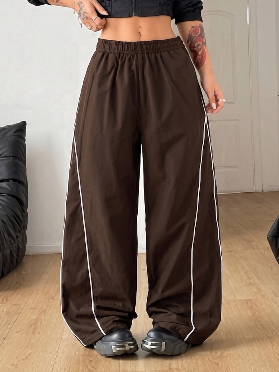 Plus size loose straight leg casual pants with elastic drawstring waist, contrast binding, and side pockets.