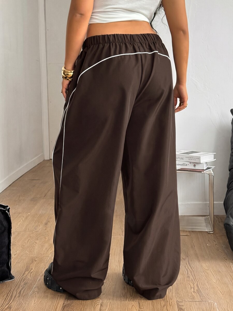 Plus size loose straight leg casual pants with elastic drawstring waist, contrast binding, and side pockets.