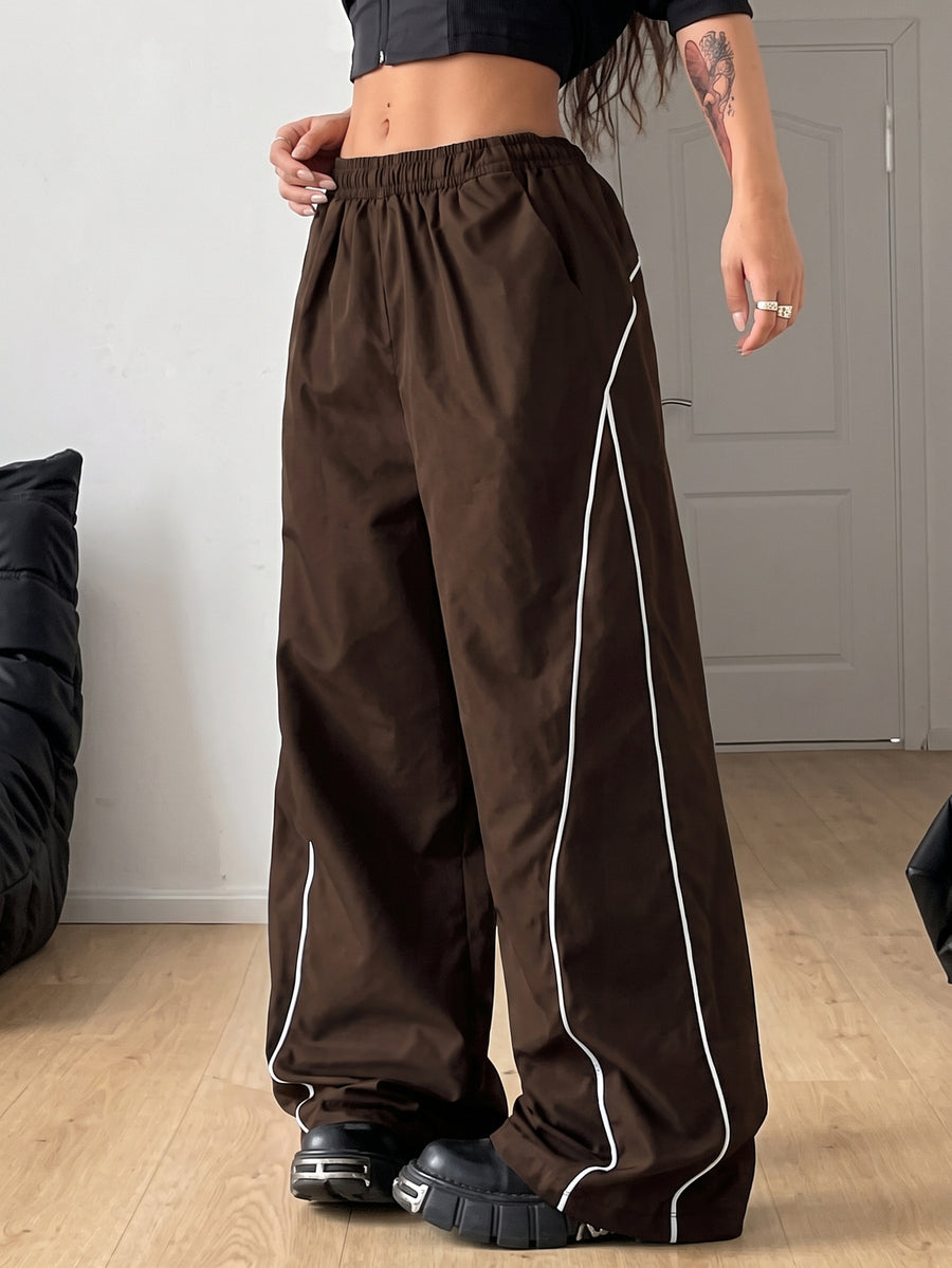 Plus size loose straight leg casual pants with elastic drawstring waist, contrast binding, and side pockets.