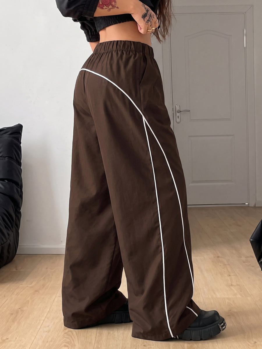 Plus size loose straight leg casual pants with elastic drawstring waist, contrast binding, and side pockets.