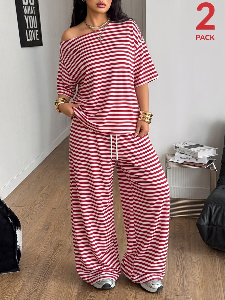 Women's casual two-piece outfit featuring a loose short-sleeve asymmetrical neck t-shirt and matching long wide leg pants with pockets.