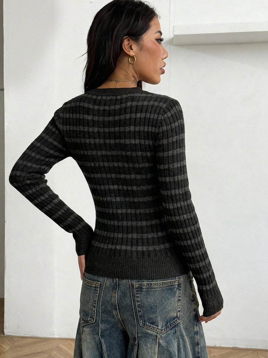 Women's slim fit cable-knit sweater with a V-neckline and long sleeves in solid green rib knit fabric.
