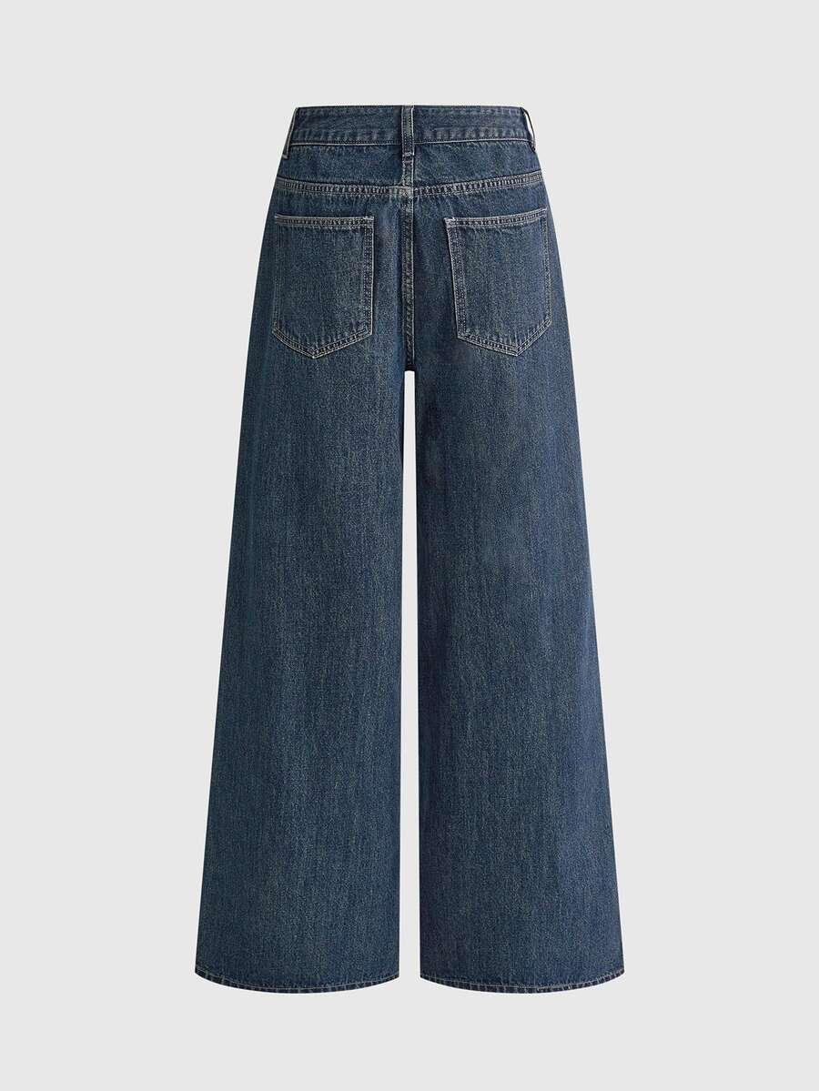 Women's loose baggy blue denim jeans featuring embroidered dragonfly and ladybug patch appliques, front pockets, and a straight-leg cut.