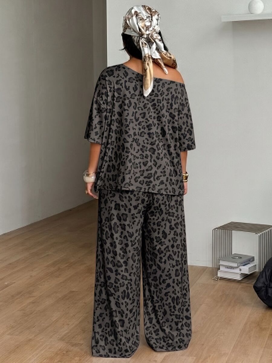 Women's two-piece lounge set featuring a loose drop shoulder asymmetrical neck short sleeve t-shirt and wide-leg knit pants with pockets.