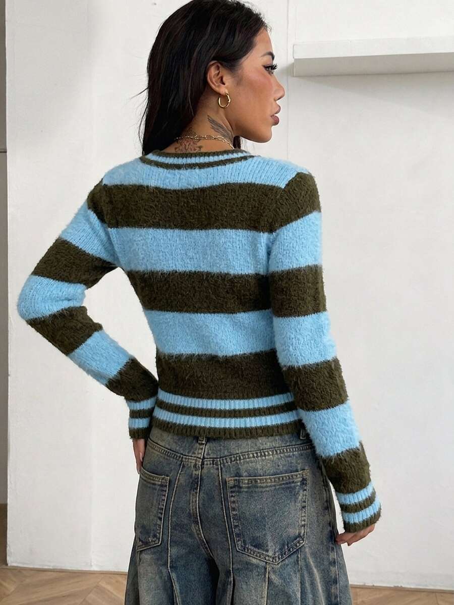 Women's slim fit cable-knit sweater with a V-neckline and long sleeves in solid green rib knit fabric.