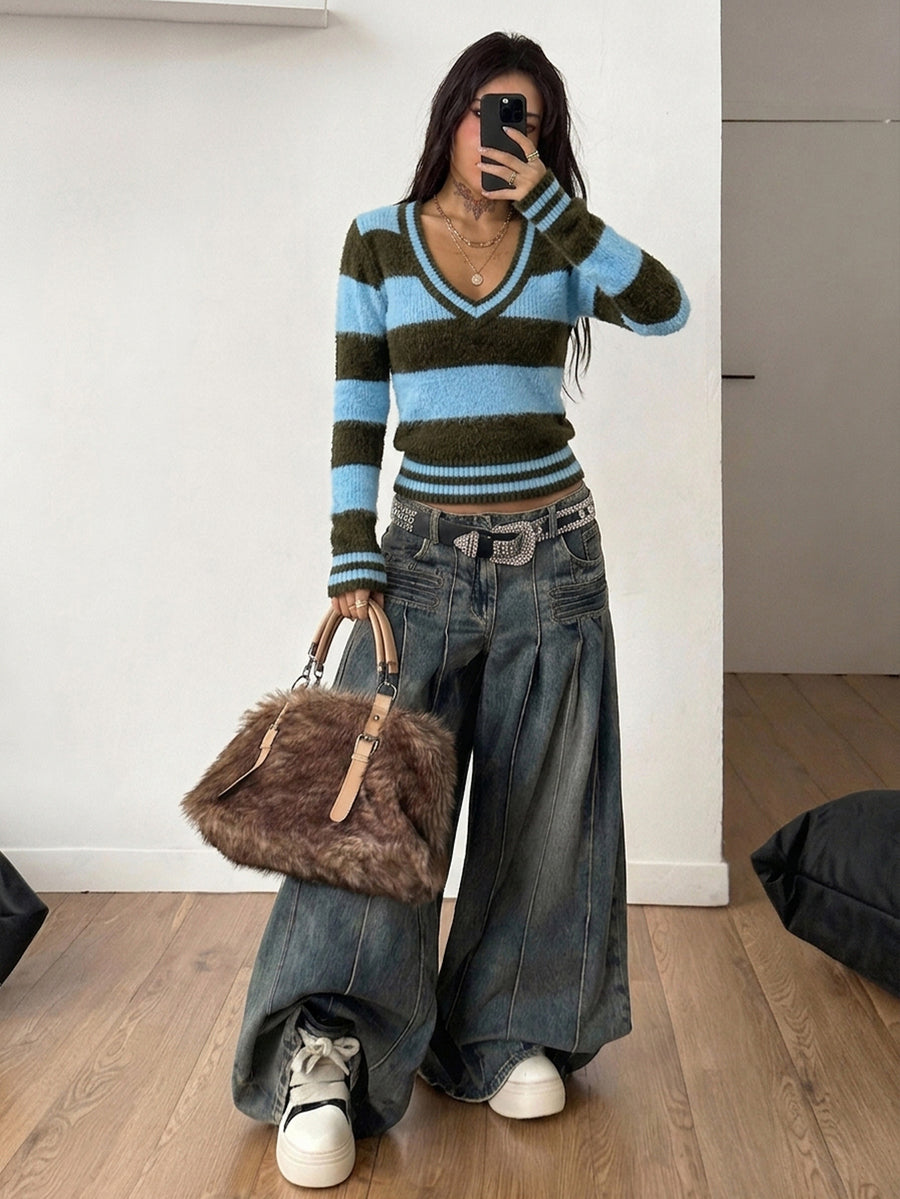 Women's slim fit cable-knit sweater with a V-neckline and long sleeves in solid green rib knit fabric.