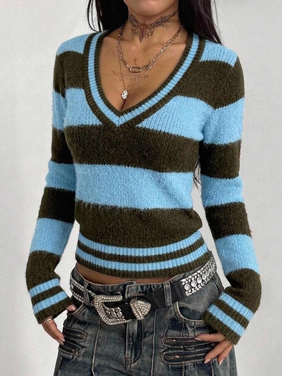 Women's slim fit cable-knit sweater with a V-neckline and long sleeves in solid green rib knit fabric.