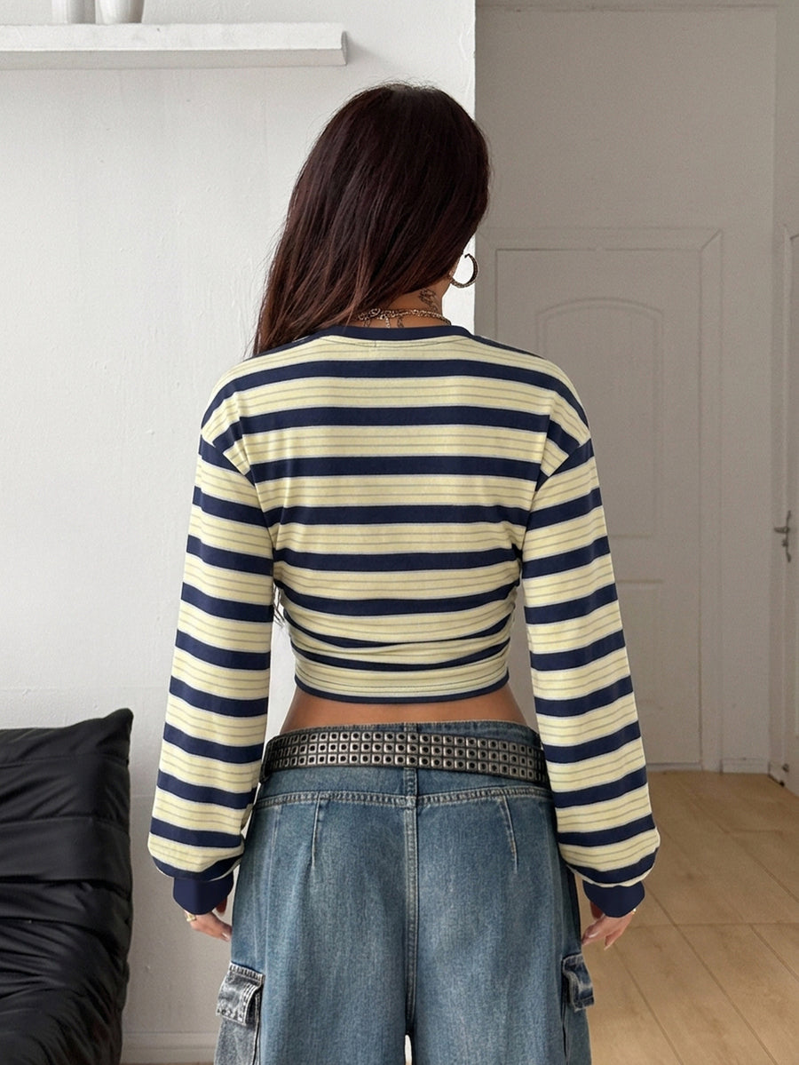 Women's striped pullover sweatshirt featuring drop shoulder long sleeves and a classic round neckline.