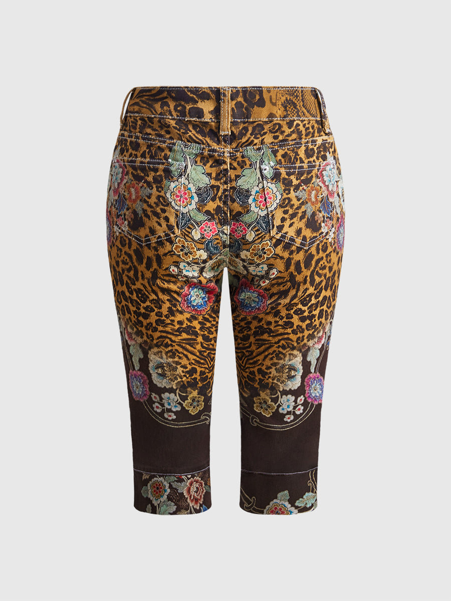 Women's leopard and floral print denim capri jeans featuring an ultra low waist and zipper fly closure.