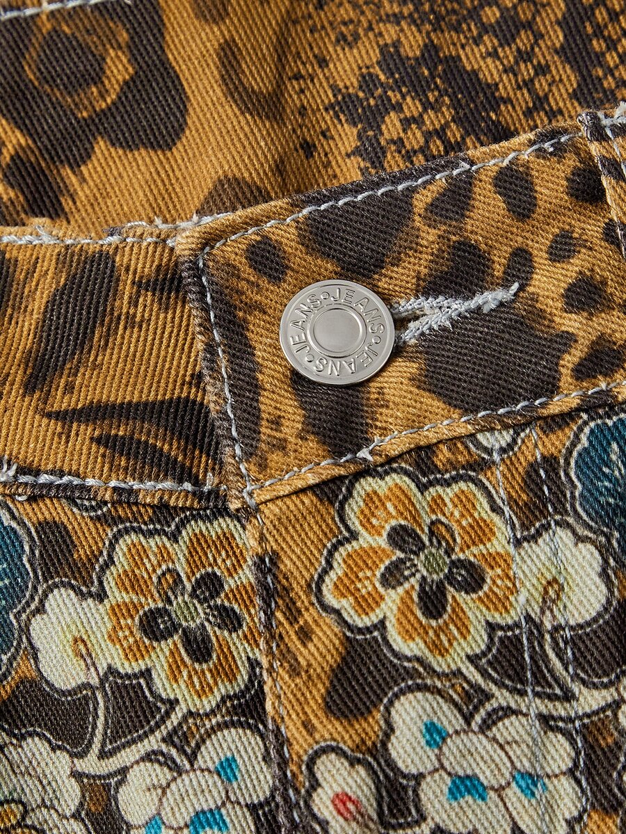 Women's leopard and floral print denim capri jeans featuring an ultra low waist and zipper fly closure.