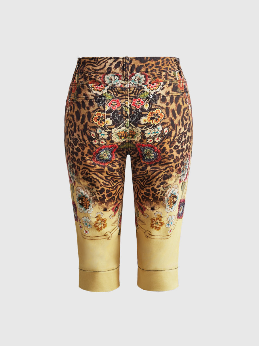 Women's leopard and floral print denim capri jeans featuring an ultra low waist and zipper fly closure.