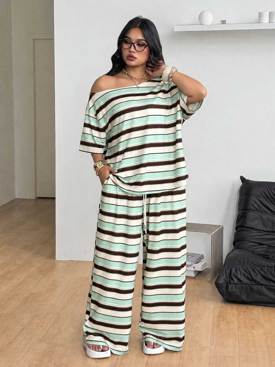 Striped two-piece casual outfit featuring an asymmetrical off-shoulder short-sleeve top and matching loose wide-leg pants with side pockets.