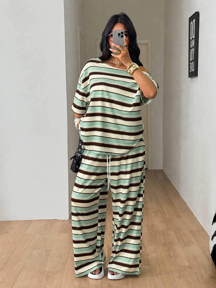 Striped two-piece casual outfit featuring an asymmetrical off-shoulder short-sleeve top and matching loose wide-leg pants with side pockets.