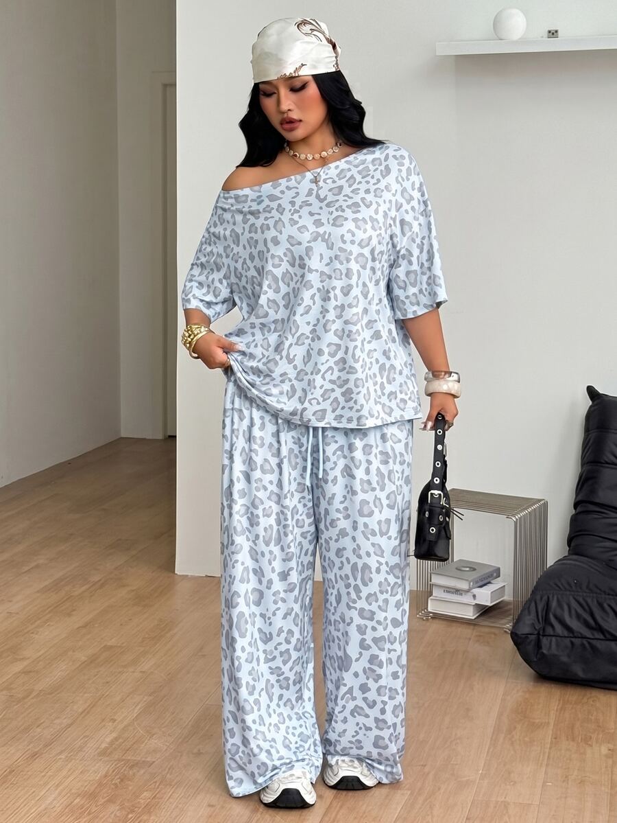 Women's two-piece lounge set featuring a loose drop shoulder asymmetrical neck short sleeve t-shirt and wide-leg knit pants with pockets.