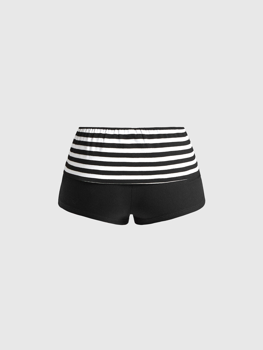 Women's ultra low waist mini shorts with folded waistband, striped letter print, and studded details in stretchy knitted fabric.