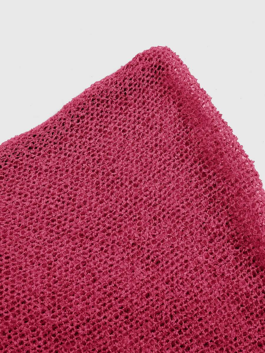 Women's casual hollow knit poncho top with boat neck, cloak sleeves, and asymmetrical hem