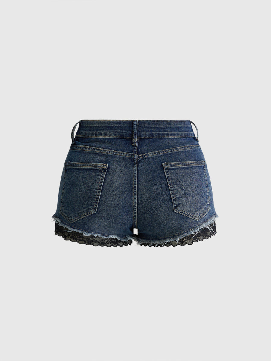 Front view of women's plus size skinny denim shorts featuring lace patchwork detailing, mid-rise waist, button zipper closure, and classic pockets.