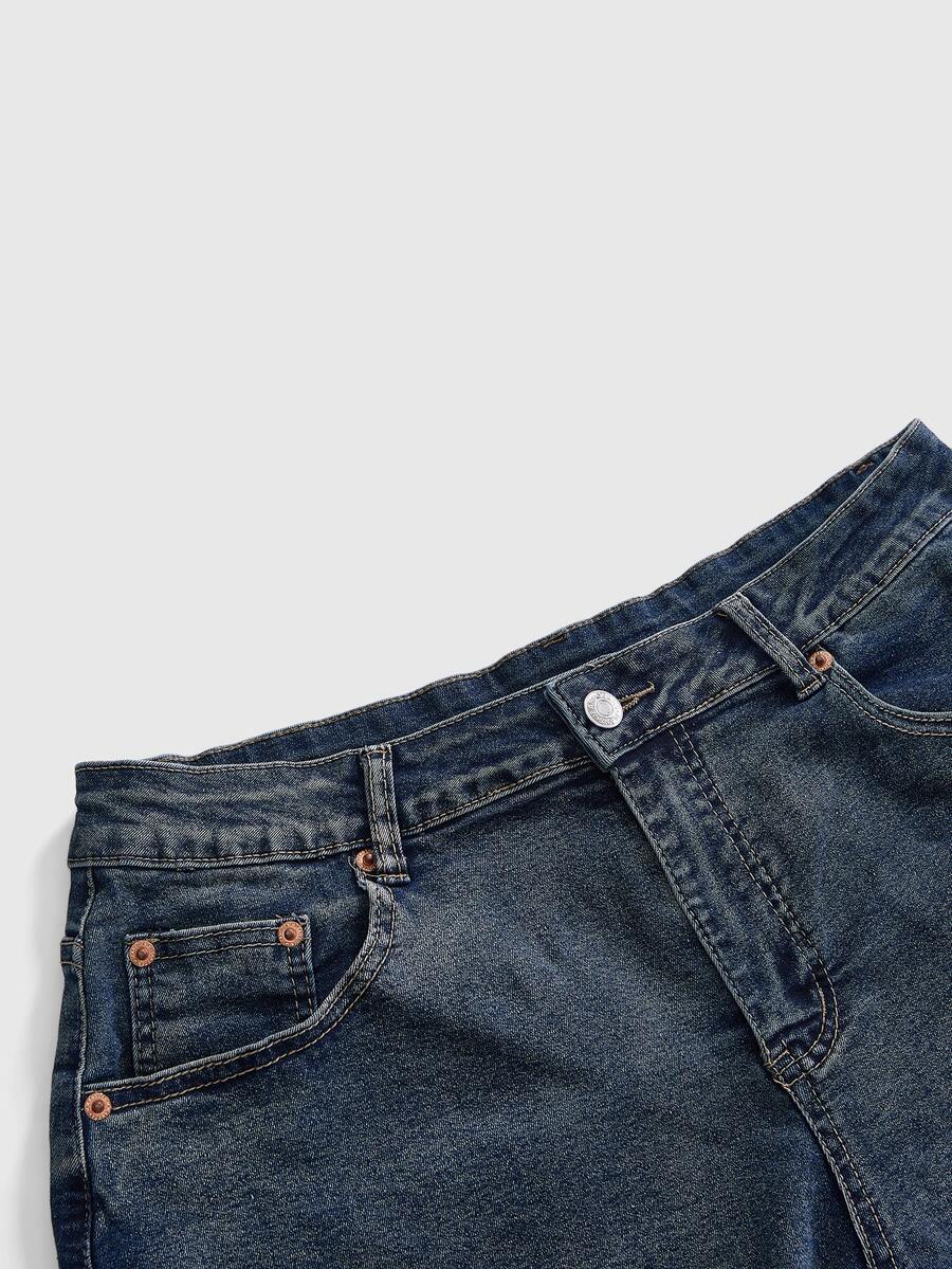 Front view of women's plus size skinny denim shorts featuring lace patchwork detailing, mid-rise waist, button zipper closure, and classic pockets.