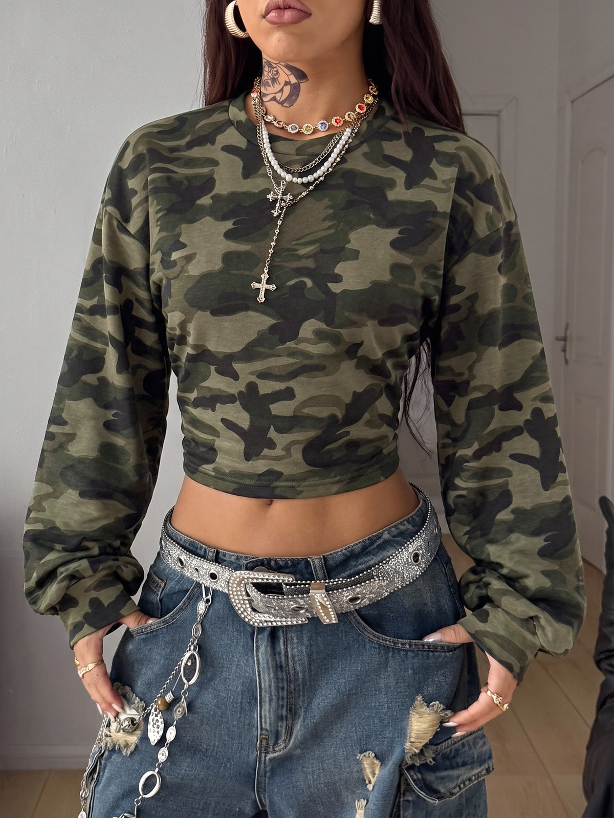 Women's striped pullover sweatshirt featuring drop shoulder long sleeves and a classic round neckline.