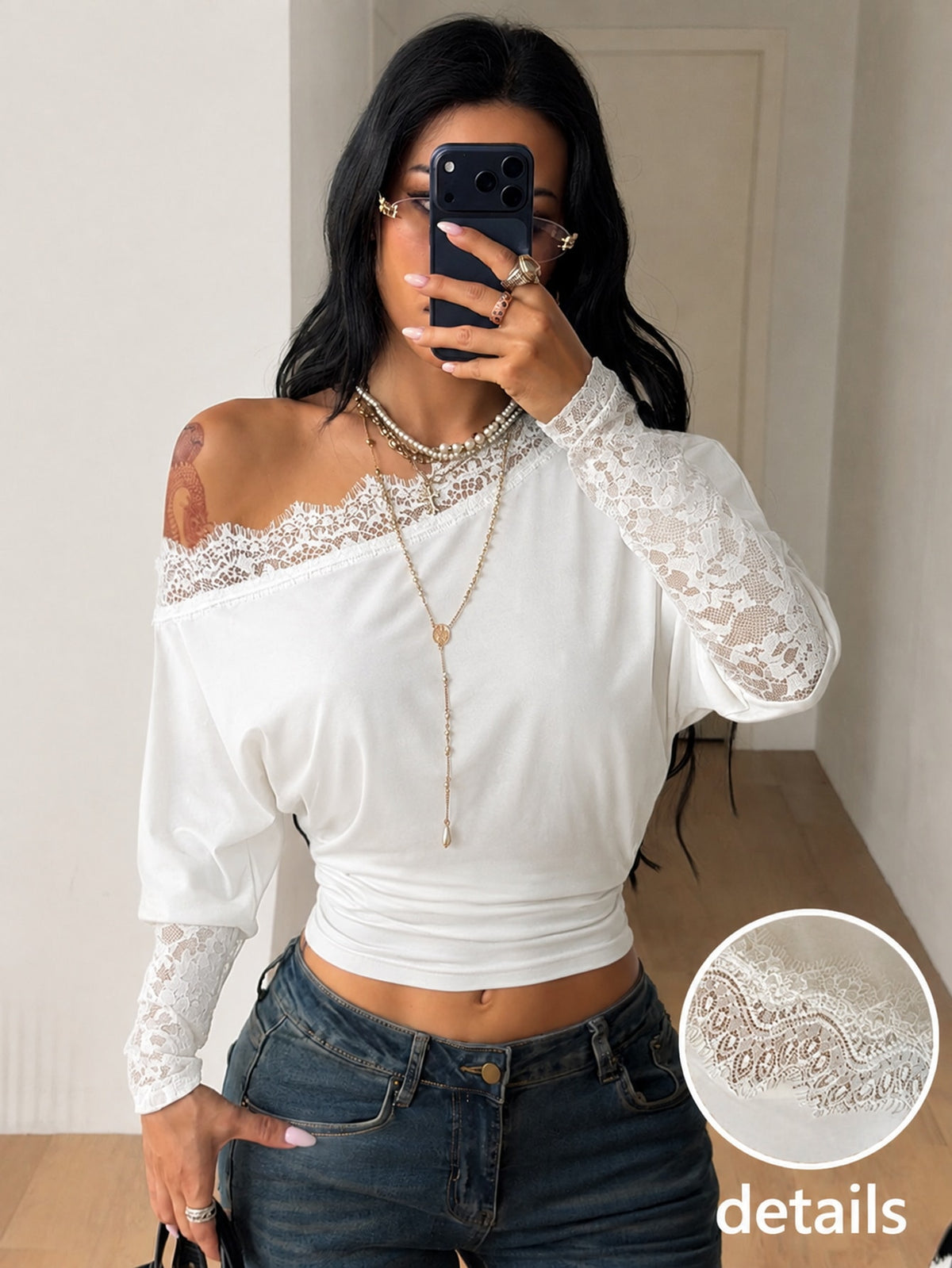 Women's black long sleeve t-shirt featuring delicate contrast lace details and a boat neckline in a knitted stretch fabric.