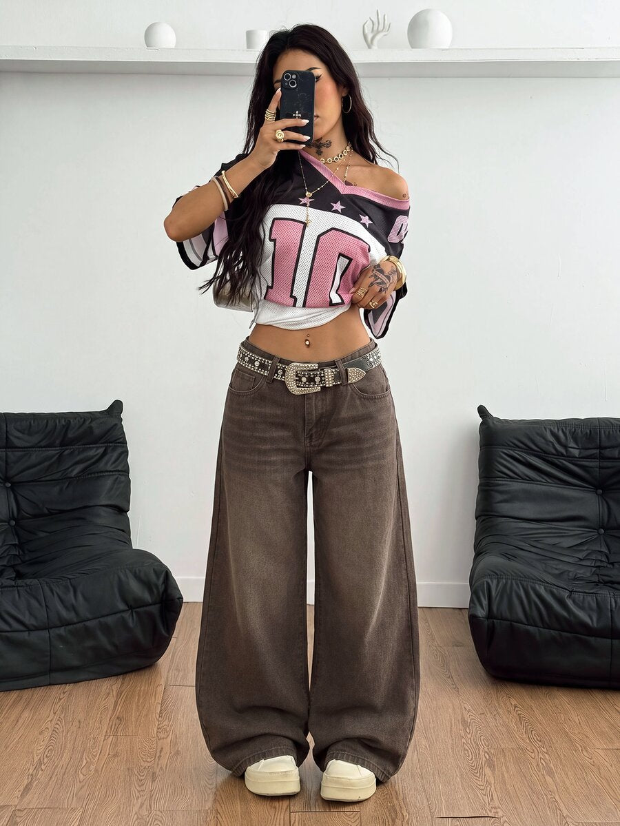 Loose wide leg denim jeans for women featuring a low waist, functional pockets, zipper fly closure, and extra long relaxed fit.