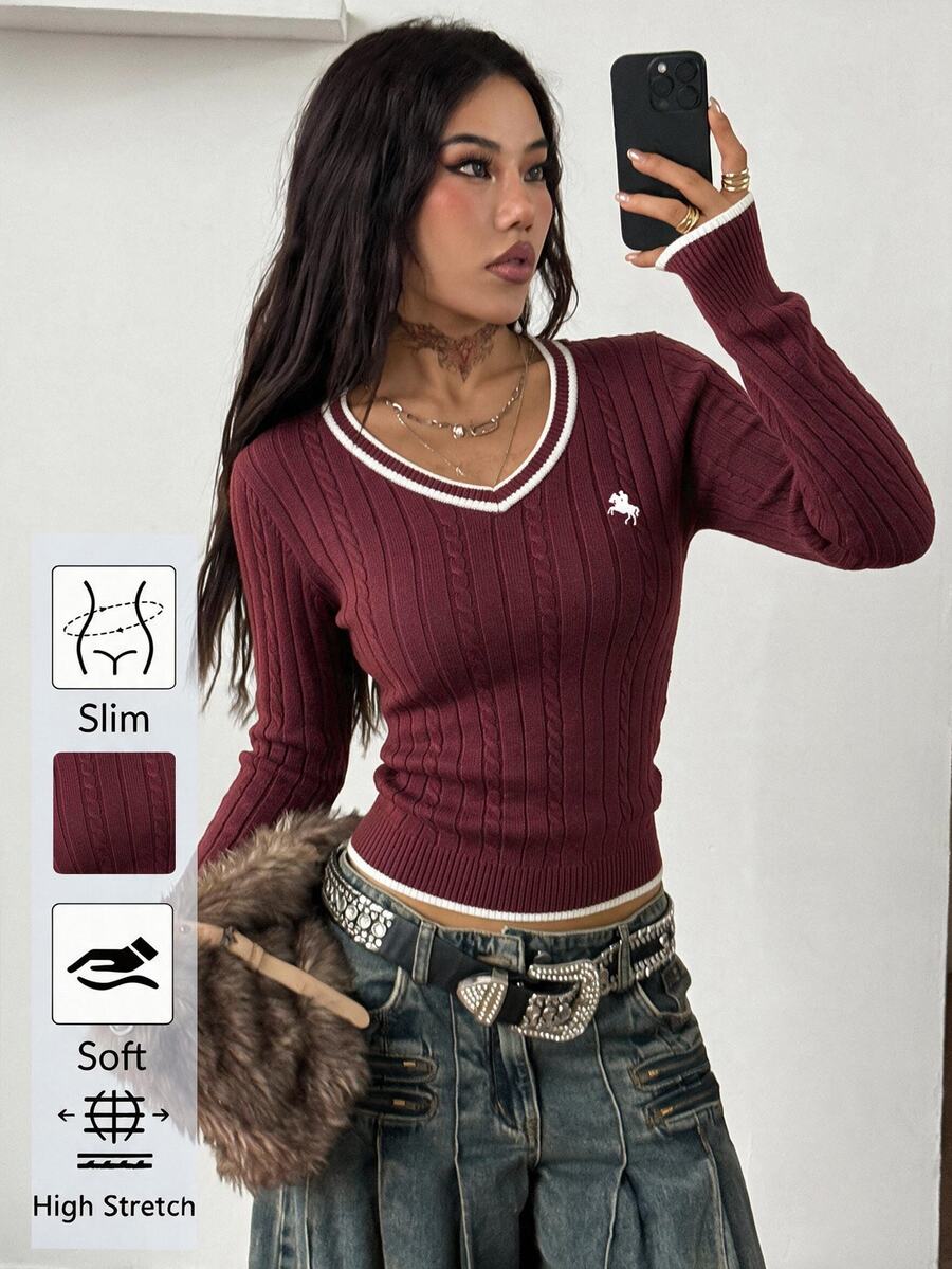 Women's slim fit cable-knit sweater with a V-neckline and long sleeves in solid green rib knit fabric.