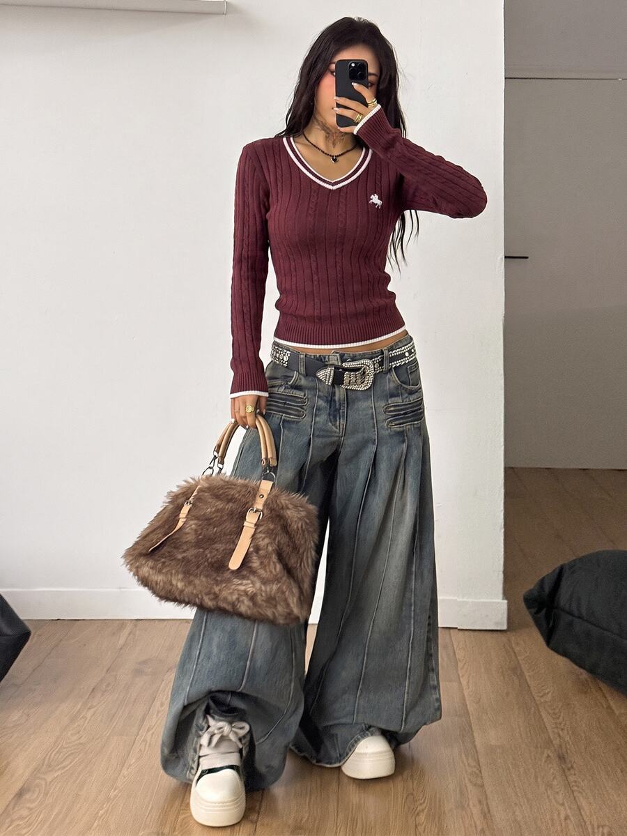Women's slim fit cable-knit sweater with a V-neckline and long sleeves in solid green rib knit fabric.