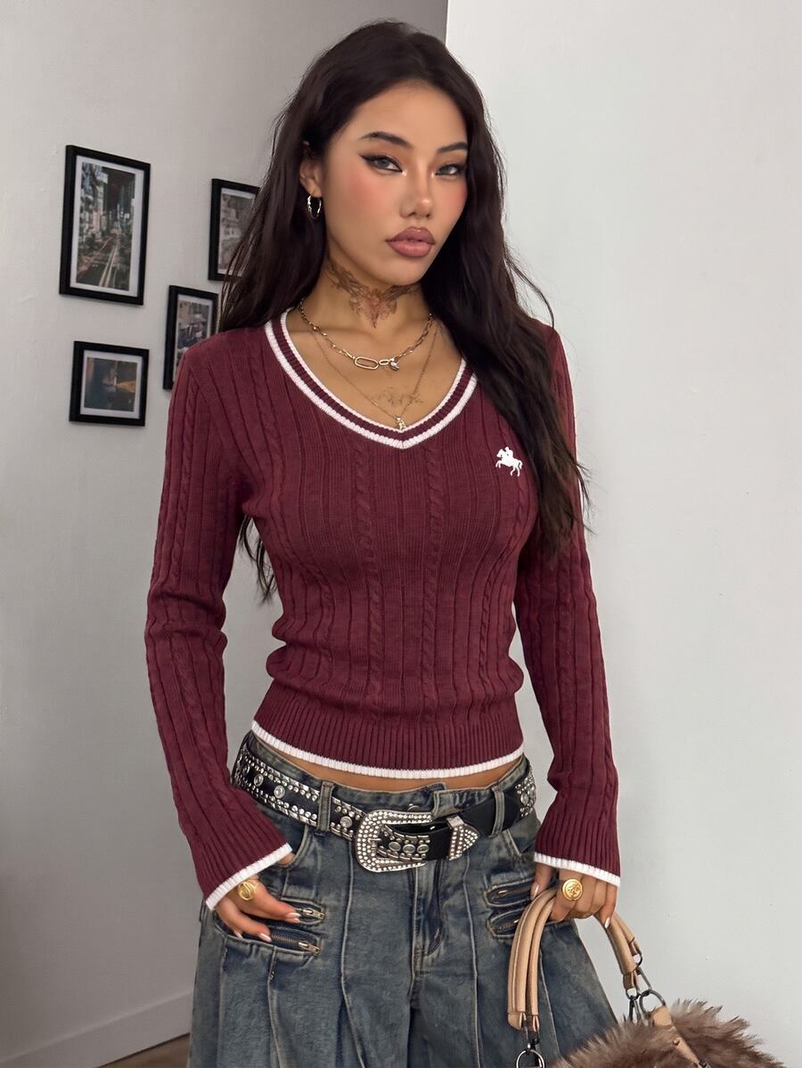 Women's slim fit cable-knit sweater with a V-neckline and long sleeves in solid green rib knit fabric.