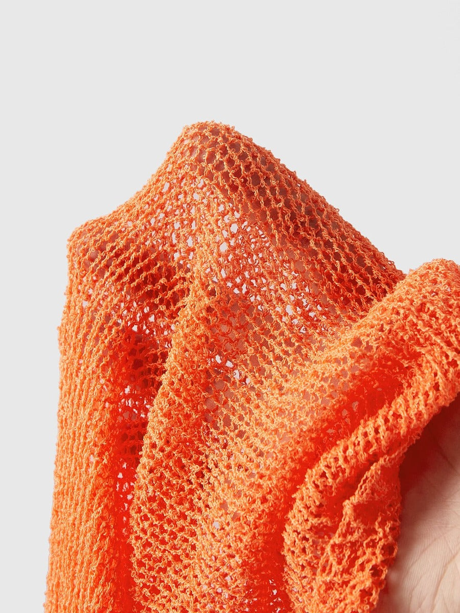 Women's casual hollow knit poncho top with boat neck, cloak sleeves, and asymmetrical hem