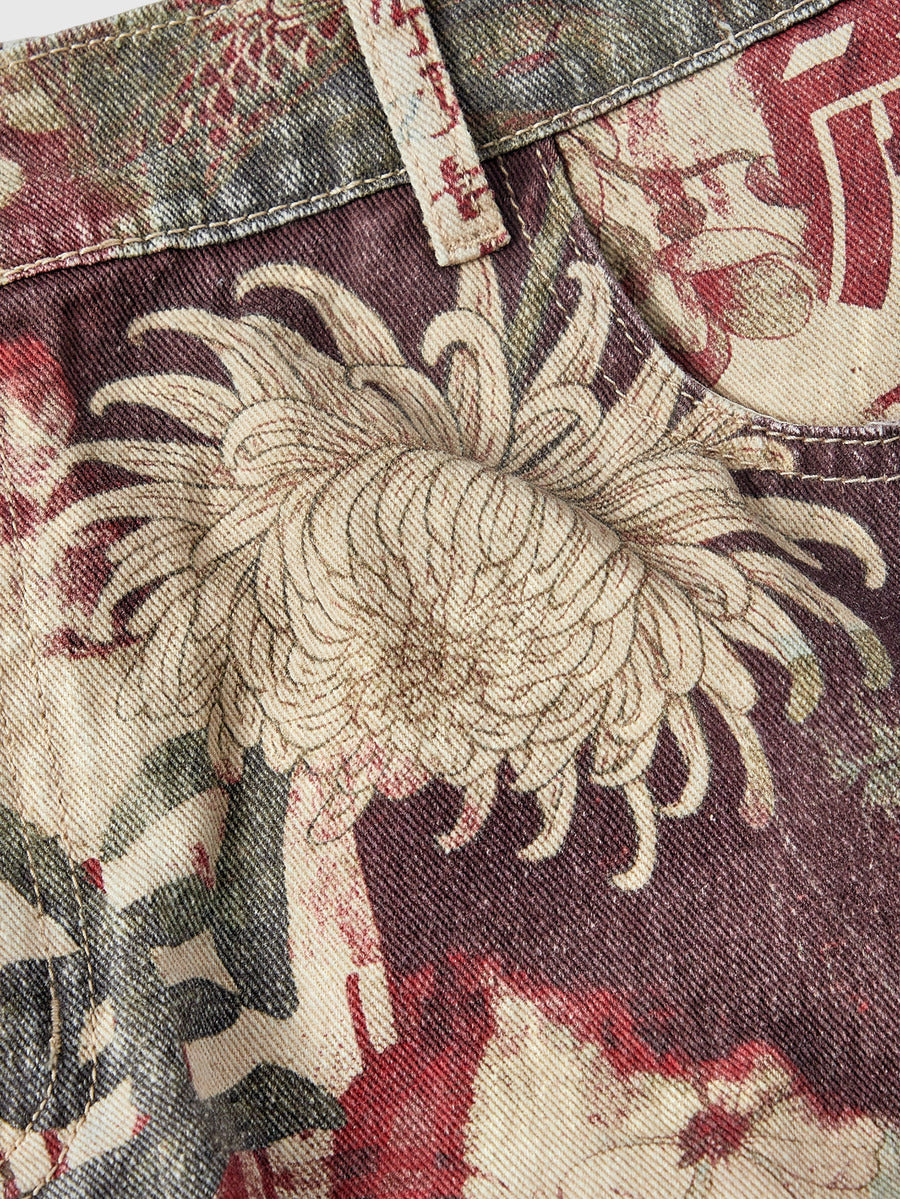 Women's loose wide-leg denim Bermuda shorts featuring vintage animal and paisley print with pockets and zipper fly.