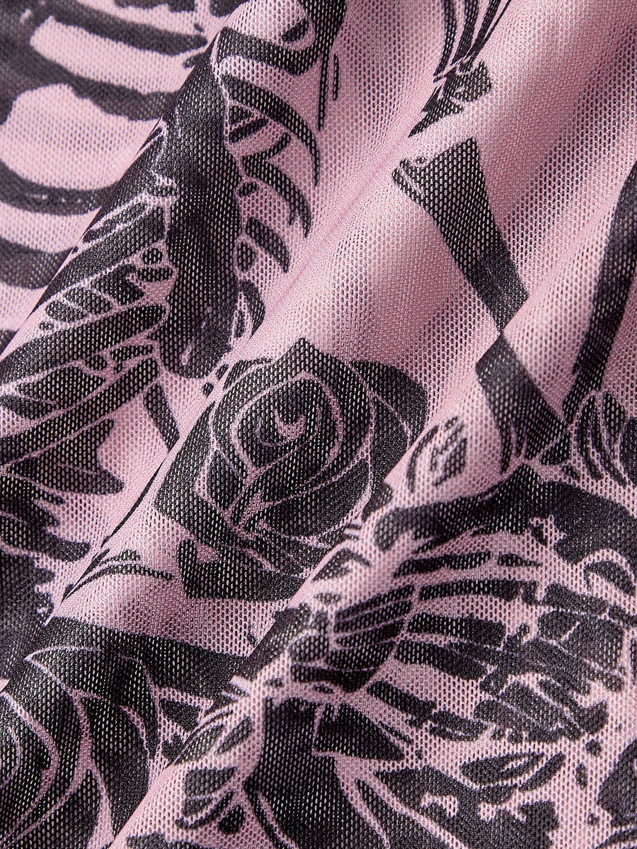 Women's sheer mesh slim fit top with allover vintage tattoo totem print, stand collar, and extra-long sleeves.