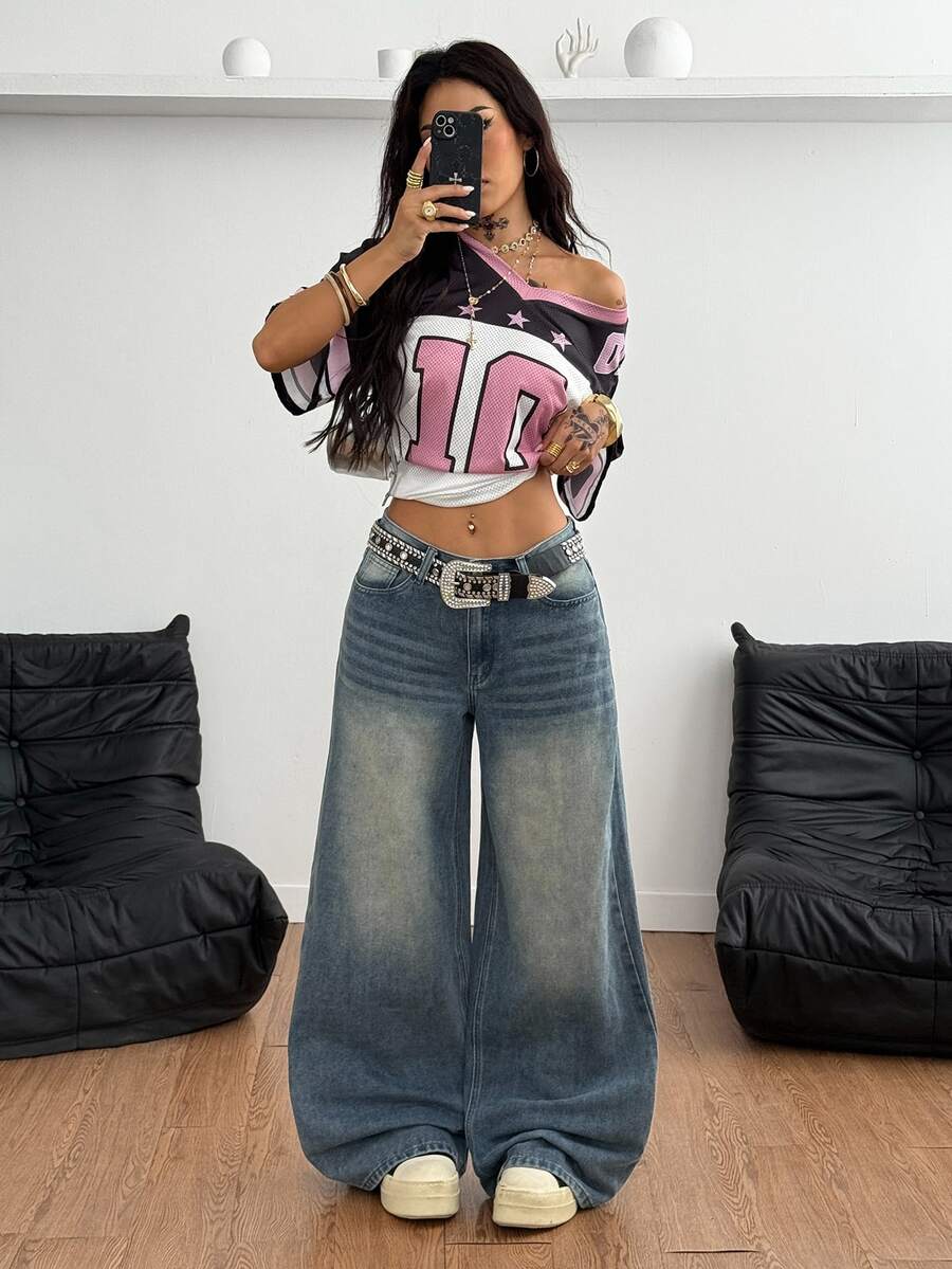 Loose wide leg denim jeans for women featuring a low waist, functional pockets, zipper fly closure, and extra long relaxed fit.