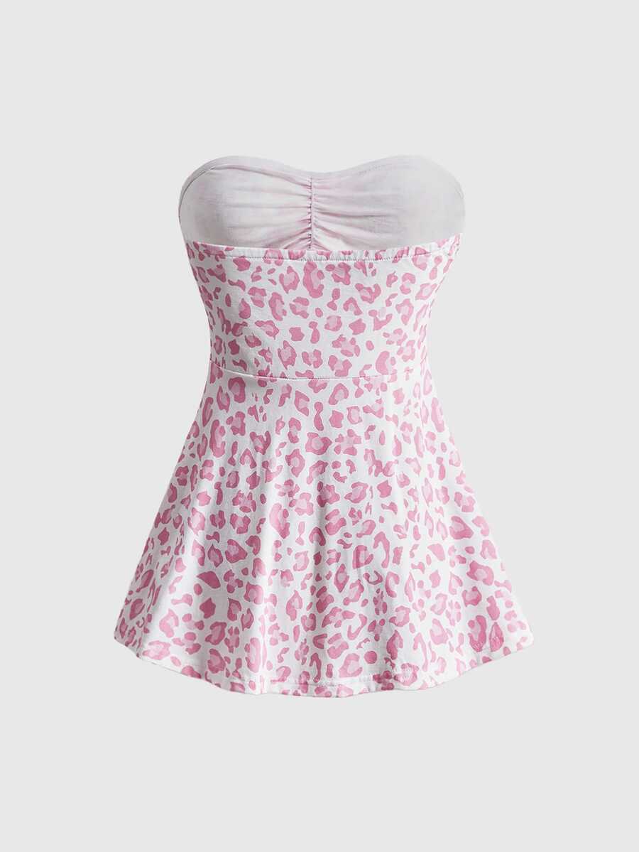 Women's striped strapless tube top featuring ruched detailing, flared hem, and stretchy knit fabric.