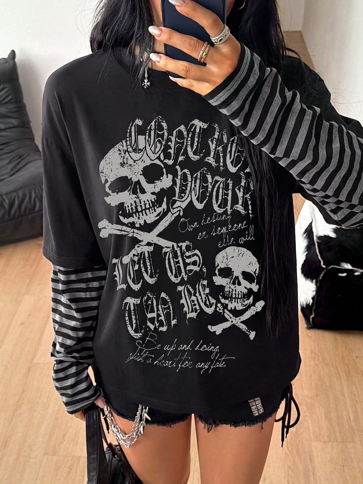 Women's casual graphic long sleeve t-shirt with a round neck, drop shoulder sleeves, and loose relaxed fit.