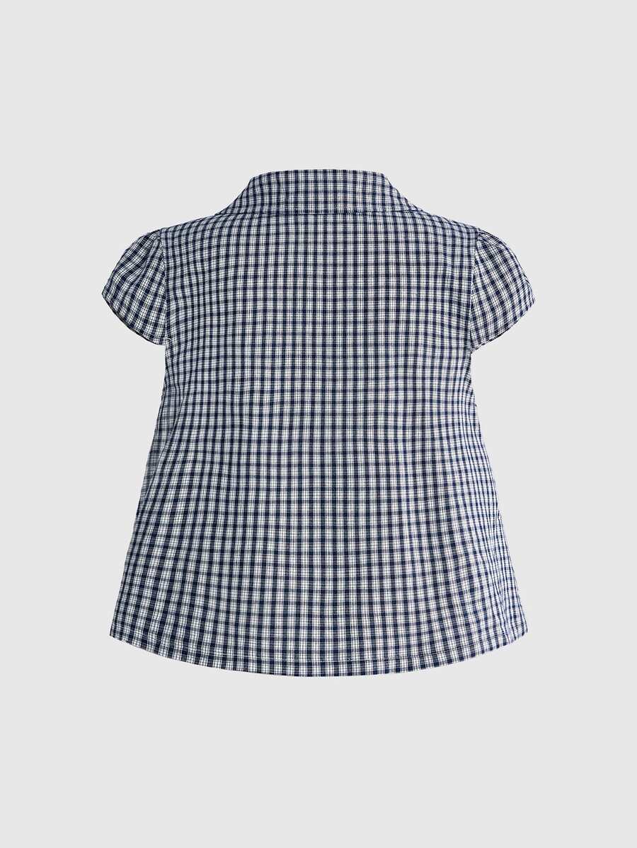 Women's short puff sleeve cotton blouse featuring a Peter Pan collar, double button detail, and front pocket.