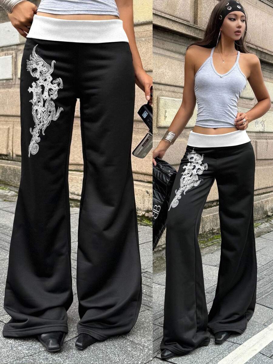 Women's black low waist wide leg flare sweatpants with rib-knit texture and contrast binding details.