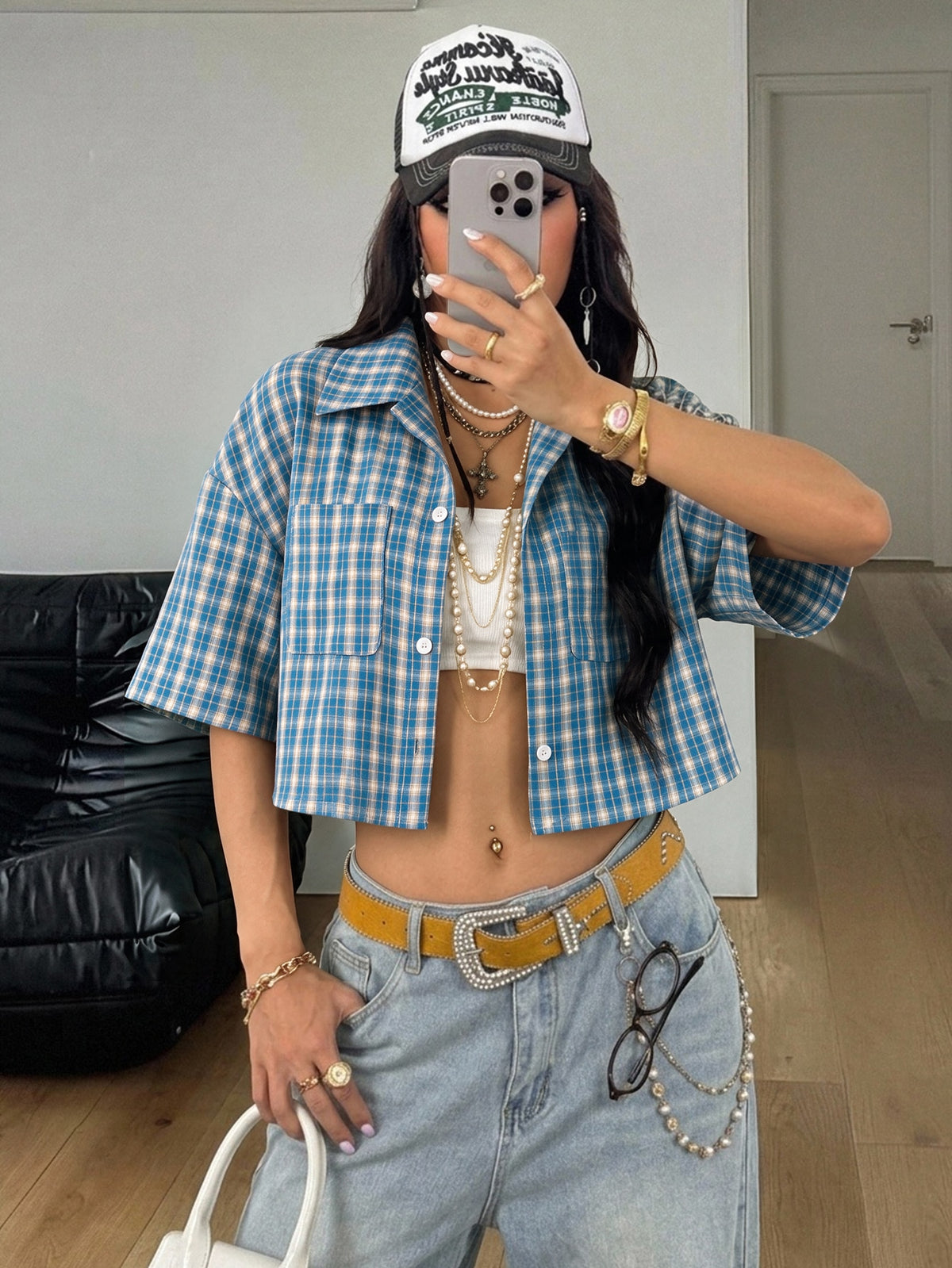 Women's plaid crop shirt with button front, chest pocket, short sleeves, and loose casual fit.