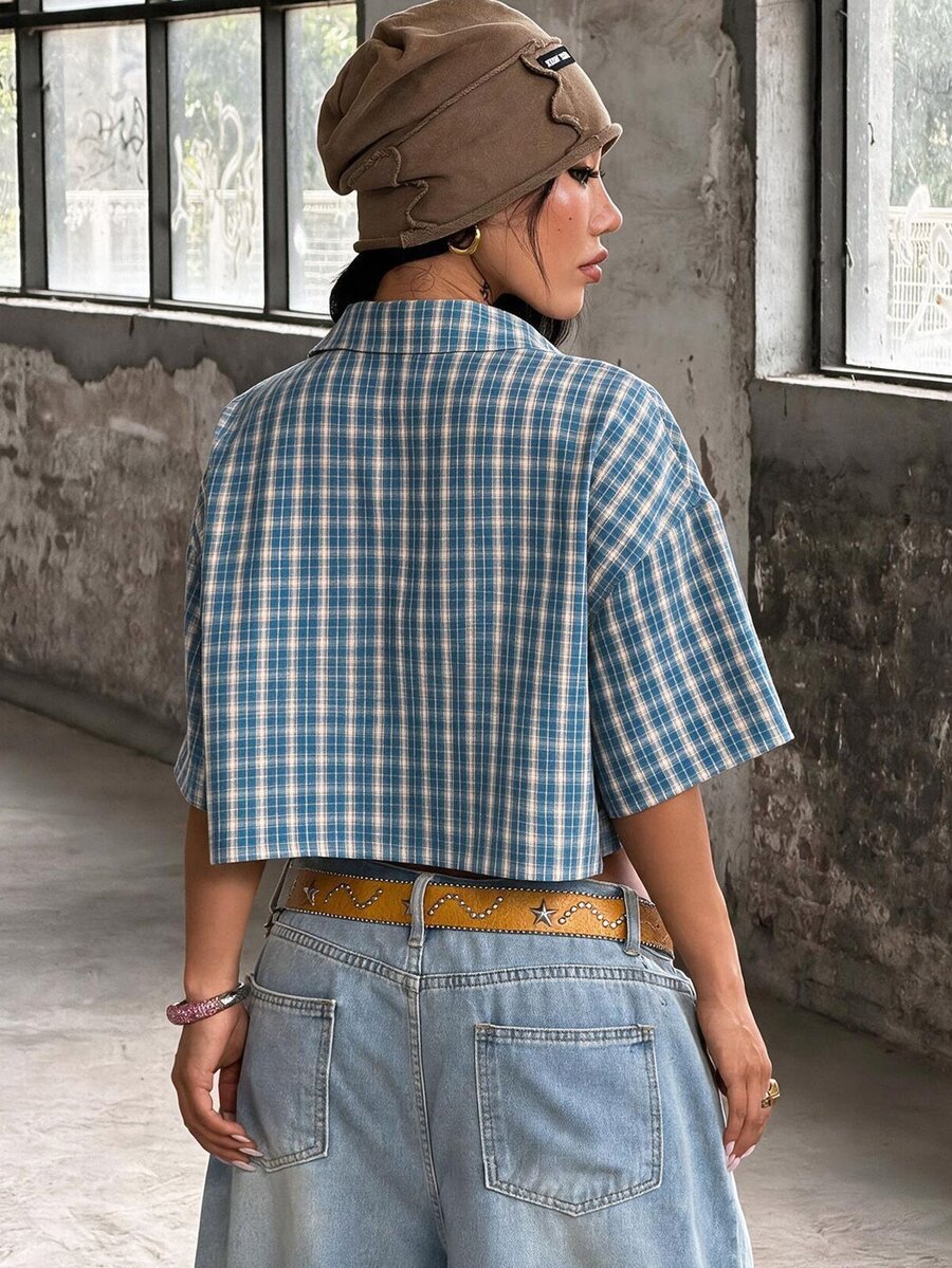 Women's plaid crop shirt with button front, chest pocket, short sleeves, and loose casual fit.